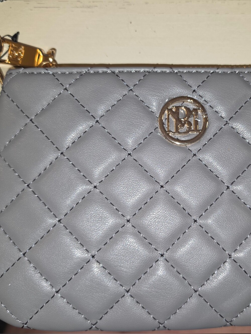 Badgley Mischka Quilted Gray Leather Wristlet with Gold Emblem